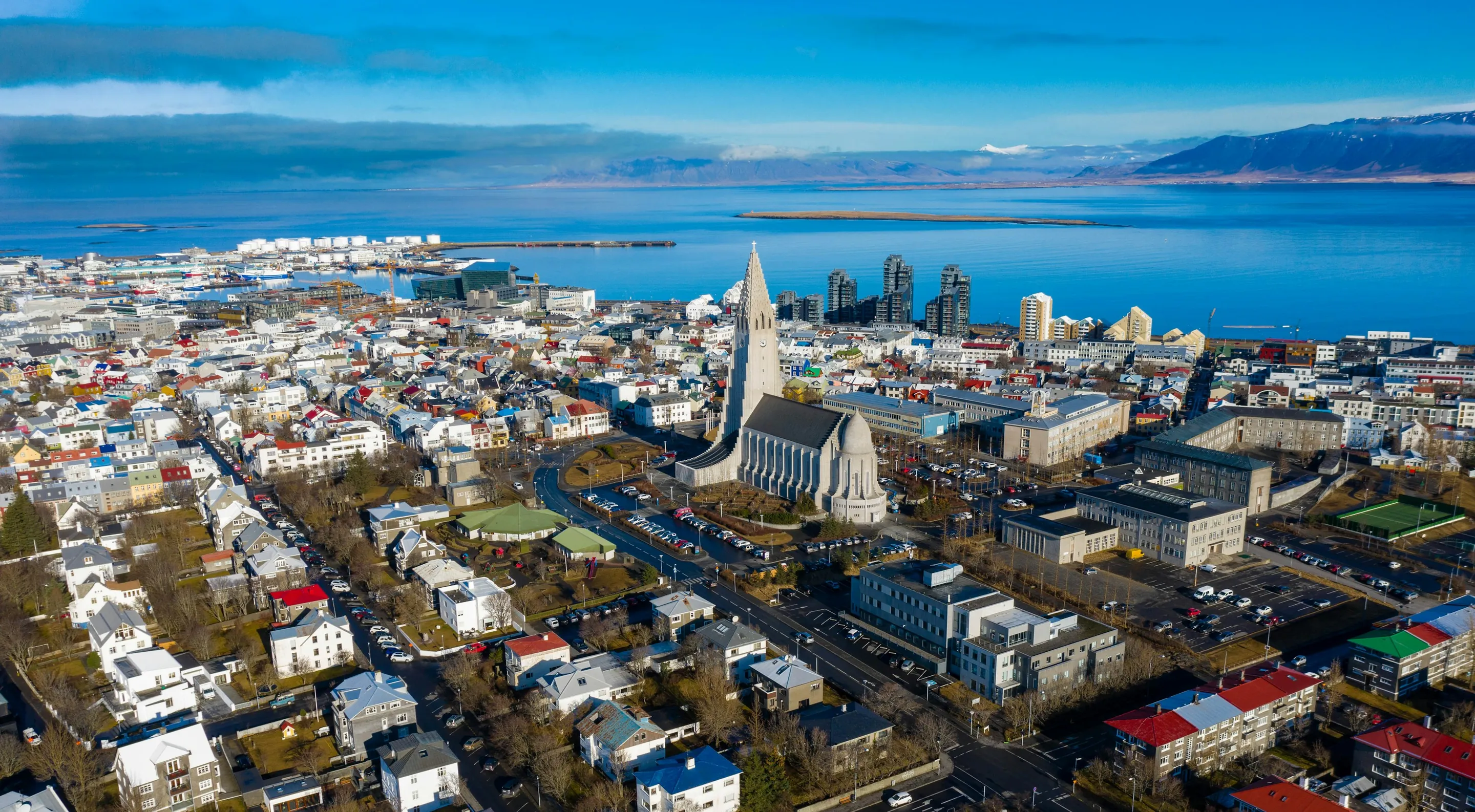 Reykjavík from above: Hallgrímskirkja among colourful roofs, the bay and mountains beyond